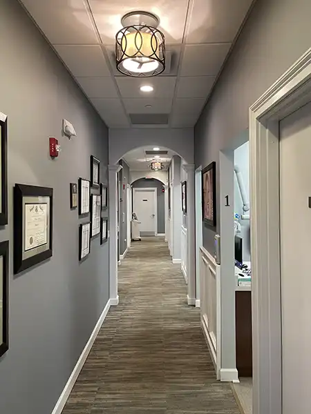 Office hallway with exam room entrances at Artistic Dental in Jackson, NJ
