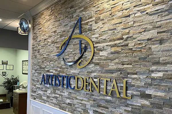 Smiling dental patient in exam chair