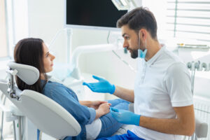 side view of dentist talking with client in hopital