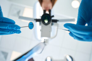 Dentist performing periodontal charting exam
