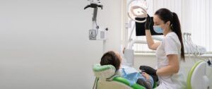 Dentist treating a patient in a dental chair